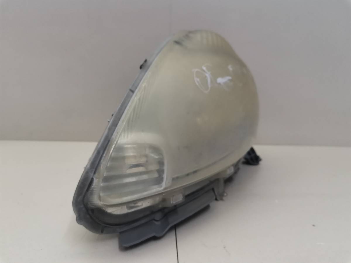 Фара левая Toyota Passo (XC10) 2004-2010