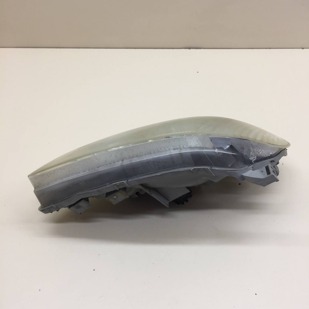 Фара левая Toyota Corolla E120 2001-2007