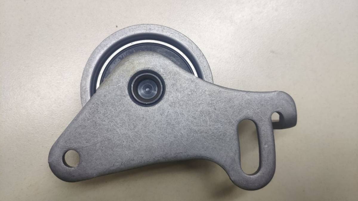 Ролик-натяжитель ремня ГРМ Mitsubishi L200 (K6,K7) 1996-2006